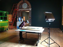 Isabel Horovitz checking painting at Royal Academy